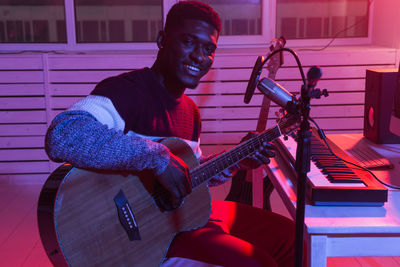 Young man playing guitar