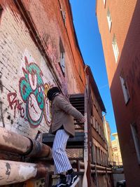 Low angle view of graffiti on building wall