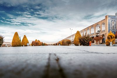 Houses against cloudy sky