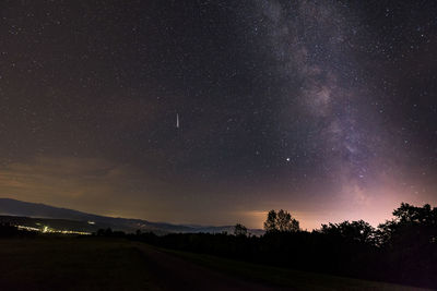 Scenic view of road against sky at night