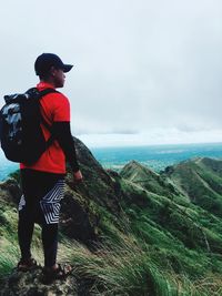 Man looking at sea against sky