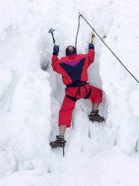 Climber climbing the iceberg