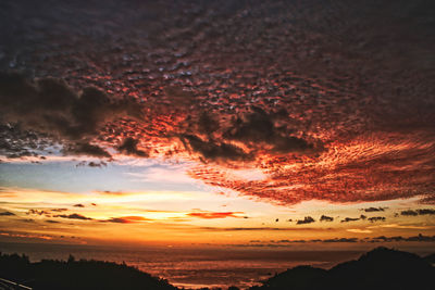 Scenic view of dramatic sky during sunset