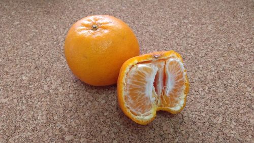 Close-up of orange on white background