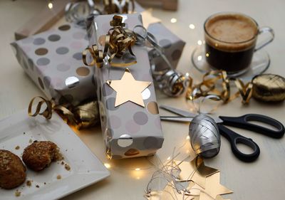 High angle view of food and christmas presents on table