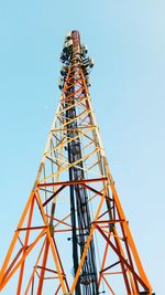 Low angle view of communications tower against sky