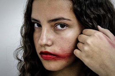 Close-up of young woman looking at camera