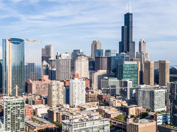 Modern buildings in city against sky