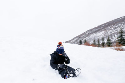 Man on snow covered field