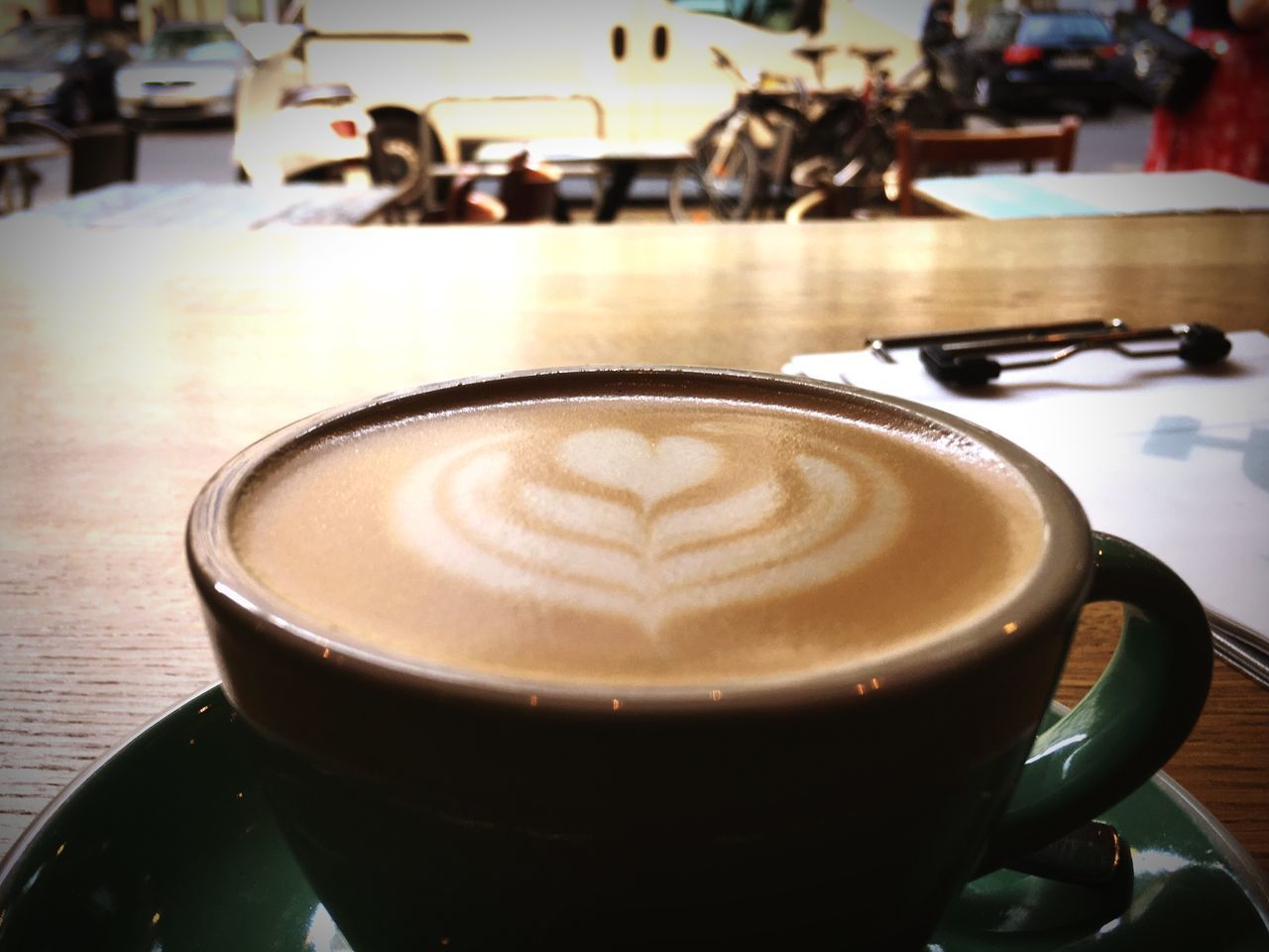 CLOSE-UP OF COFFEE CUP ON TABLE