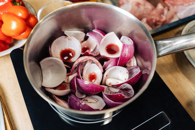 High angle view of chopped fruits in bowl on table