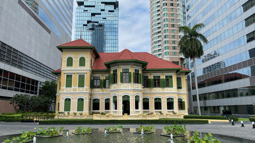 Buildings in city against sky