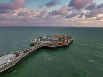 Aerial view of brighton palace pier, with the seafront behind.