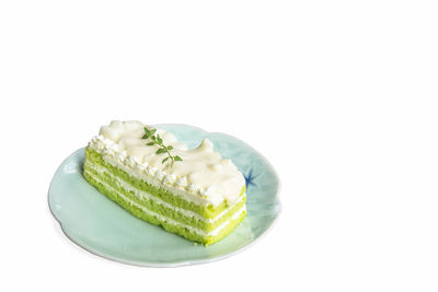 Close-up of cake against white background