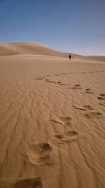 Scenic view of desert against clear sky