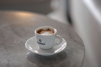 Close-up of coffee cup on table