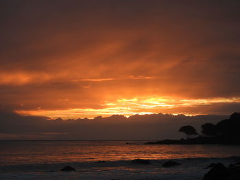 Scenic view of sea against romantic sky at sunset