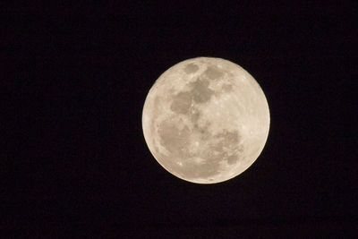 Low angle view of moon against sky at night