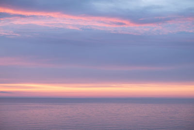 Scenic view of sea against sky during sunrise 
