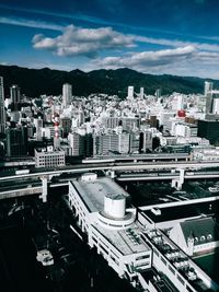 Buildings against cloudy sky