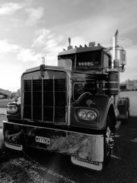 Close-up of vintage car against sky