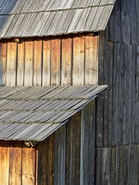 Wooden log cabin in barn