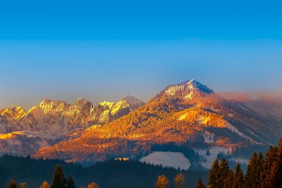 The kaiser mountains in tirol, austria, at sunset shows among others the wild emperor in the evening