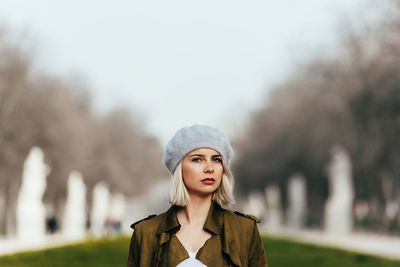 Portrait of young woman standing outdoors