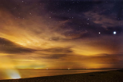 Scenic view of sea against sky at night