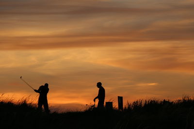 Silhouette of man at sunset