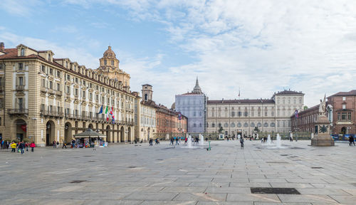 The beautiful castle square in turin with the royal palace illuminated at night