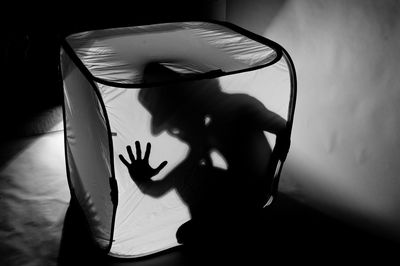 Man trapped in tent against light