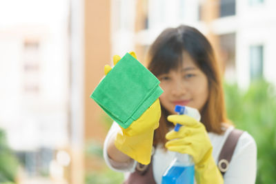 Woman cleaning glass window