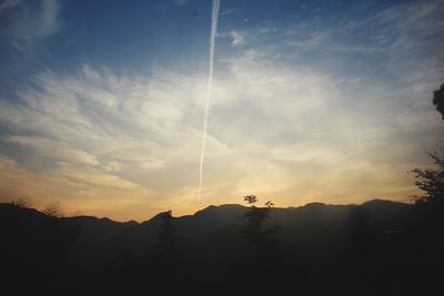 Low angle view of silhouette mountain against sky during sunset