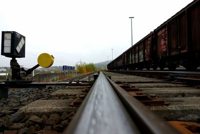 Surface level of railroad track against clear sky