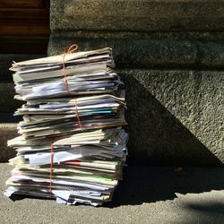 Stack of magazines against wall