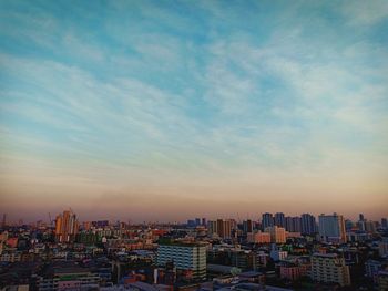 High angle view of buildings against sky during sunset