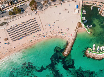 Aerial drone top down photo of small emerald sea tropical port