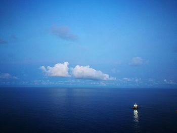 Scenic view of sea against blue sky