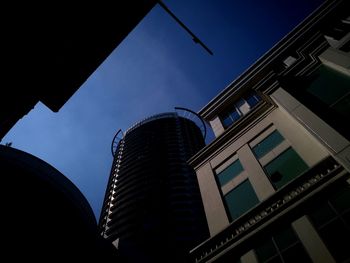 Low angle view of modern buildings against clear sky