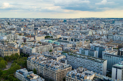 Aerial city landscape of paris, lots of roofs characteristic roofs and chimney