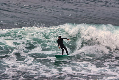 Man surfing in sea