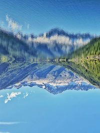 Scenic view of lake against sky during winter