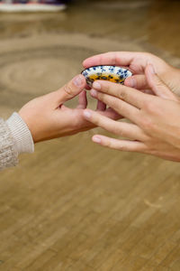 Cropped hand of woman holding hands