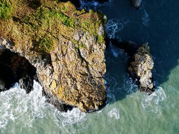 High angle view of rock formation in sea