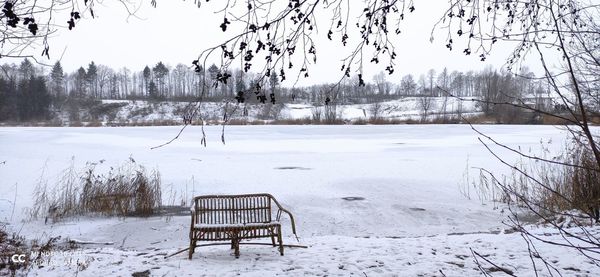 Scenic view of snow covered field against clear sky