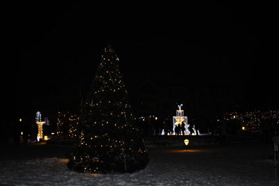 Illuminated city at night during winter