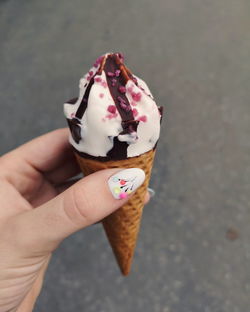 Hand holding ice cream cone