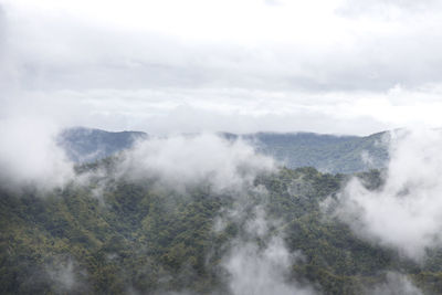 Scenic view of waterfall against sky