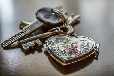 Close-up of heart shaped key ring on table